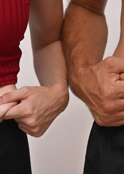 fat deposits on the abdomen of a man and a young woman. A man and a young woman measure the fat deposits on their stomachs. concept